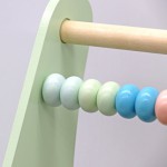 COIL Chodzik pchacz interaktywny dla dzieci jeździk edukacyjny 2w1 sorter pastelowy
